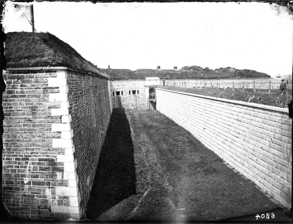 The Citadel in 1870: a stone gate in the redan, the ditch below it.