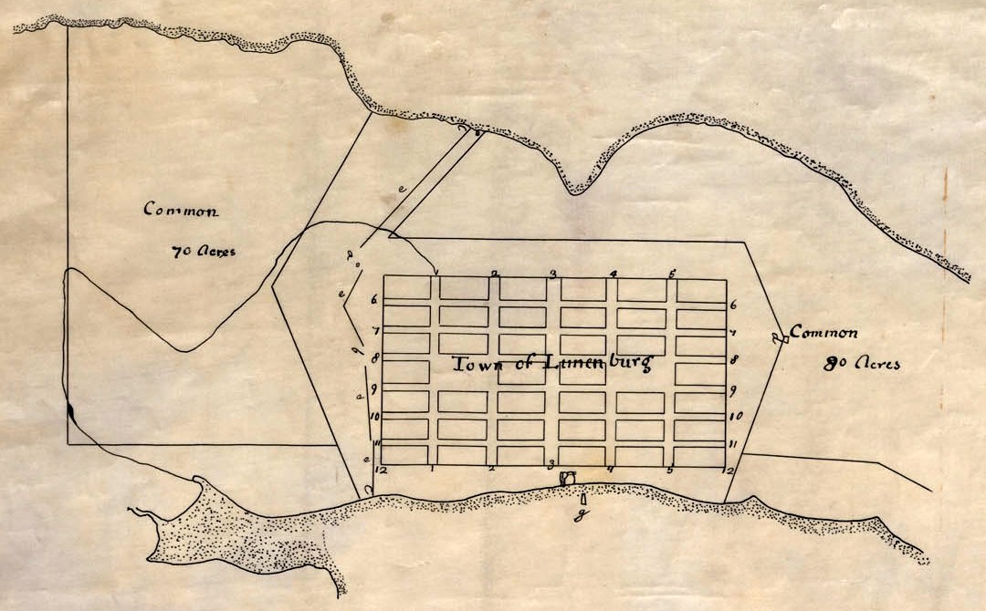 A hand-drawn plan of the town of Lunenburg: a grid of blocks between two harbours, with the commons and a fort marked.
